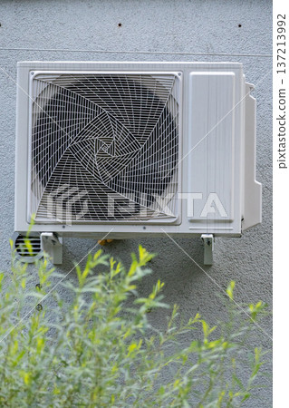 air conditioning on facade of building, air cooling in hot weather.  137213992