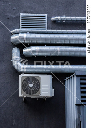air conditioning on facade of building, air cooling in hot weather. air conditioning on facade of building, air cooling in hot weather. 137213995