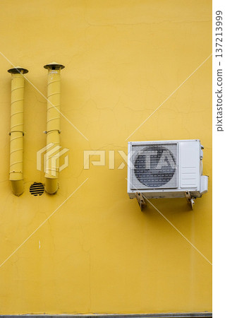 air conditioning on facade of building, air cooling in hot weather.  137213999