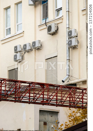 air conditioning on facade of building, air cooling in hot weather.  137214006