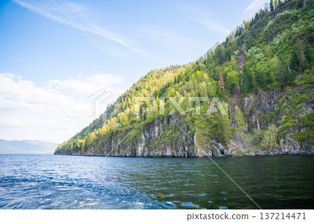 Early morning landscape of Teletskoye lake in Altai Russia. Calm water, soft light and serene mountain atmosphere near Artybash Early morning landscape of Teletskoye lake in Altai Russia. Calm water, soft light and serene mountain atmosphere near Artybash 137214471