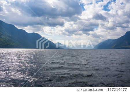 Early morning landscape of Teletskoye lake in Altai Russia. Calm water, soft light and serene mountain atmosphere near Artybash 137214477