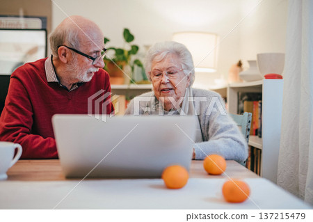 Old people having problem with laptop. Old people having problem with laptop. 137215479