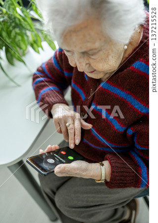 Senior facing phone scams and digital safety. Senior facing phone scams and digital safety. 137215528