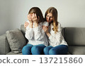 Upset offended caucasian two women, mature mother or sister and adult daughter together at home 137215860
