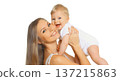 Happy cheerful smiling mother holding baby, joyful young mom and little child on white background 137215863