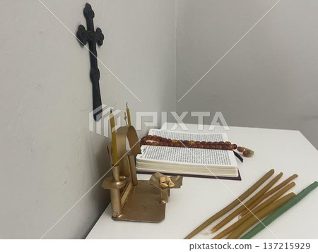 open bible, candles and rosary in the home altar open bible, candles and rosary in the home altar 137215929