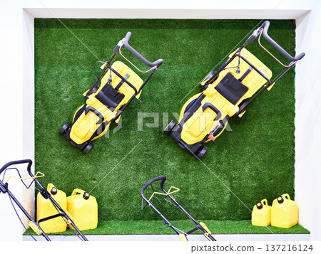 Lawn mowers on the grass Lawn mowers on the grass 137216124