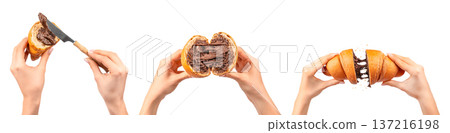 Hands Spreading and Breaking Chocolate Croissant Isolated on White Hands Spreading and Breaking Chocolate Croissant Isolated on White 137216198