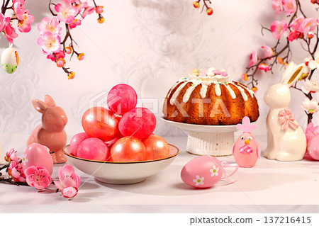 Happy Easter concept, abstract Easter composition featuring a traditional Russian meringue kulich and painted eggs on elegant kitchen table with spring cherry blossoms, banner for a greeting message Happy Easter concept, abstract Easter composition featuring a traditional Russian meringue kulich and painted eggs on elegant kitchen table with spring cherry blossoms, banner for a greeting message 137216415