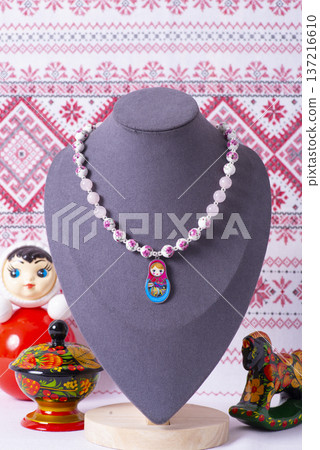Russian symbols matryoshka, balalaika, rubles cash and flag of russian federation on wooden background. Russian symbols matryoshka, balalaika, rubles cash and flag of russian federation on wooden background. 137216610