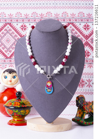 Russian symbols matryoshka, balalaika, rubles cash and flag of russian federation on wooden background. Russian symbols matryoshka, balalaika, rubles cash and flag of russian federation on wooden background. 137216611