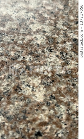 Granite texture with a mix of brown, black, and white speckles, suitable for background use Granite texture with a mix of brown, black, and white speckles, suitable for background use 137217056