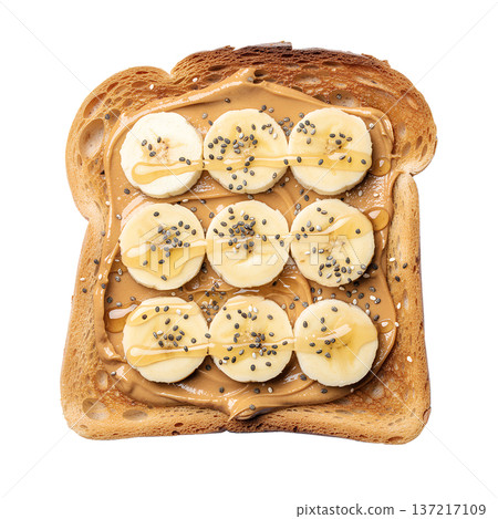 Slice of toast spread with peanut butter, topped with fresh banana slices, chia seeds, and a honey drizzle, isolated Slice of toast spread with peanut butter, topped with fresh banana slices, chia seeds, and a honey drizzle, isolated 137217109