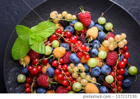 Overhead composition of assorted forest berries in ceramic plate Overhead composition of assorted forest berries in ceramic plate 137217130