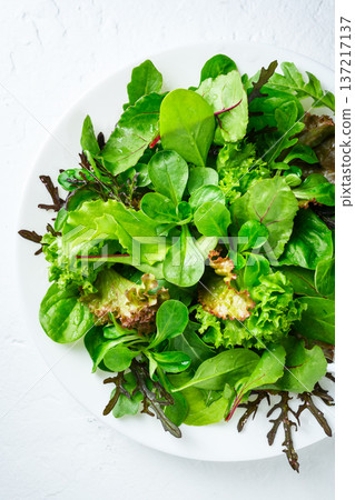 Salad greens with lettuce leaves shown from above 137217137