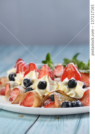 French crepes with cream and berries French crepes with cream and berries 137217165