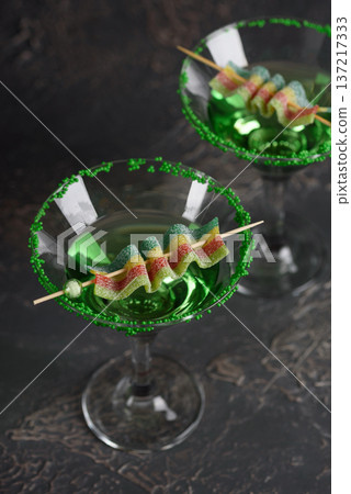 Green Cocktails with Rainbow Candy and Shamrocks. Festive St. Patricks Day Celebration Still Life Green Cocktails with Rainbow Candy and Shamrocks. Festive St. Patricks Day Celebration Still Life 137217333