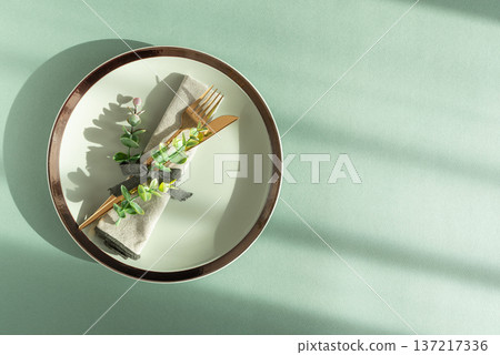 Elegant Table Setting with Napkin and Gold Cutlery. Stylish Easter Spring Arrangement under Sun Light Elegant Table Setting with Napkin and Gold Cutlery. Stylish Easter Spring Arrangement under Sun Light 137217336