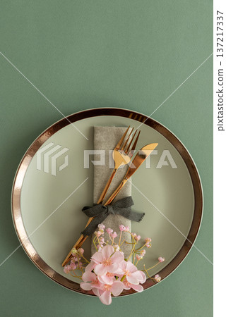 Elegant Table Setting with Napkin and Gold Cutlery. Stylish Easter Spring Arrangement Elegant Table Setting with Napkin and Gold Cutlery. Stylish Easter Spring Arrangement 137217337