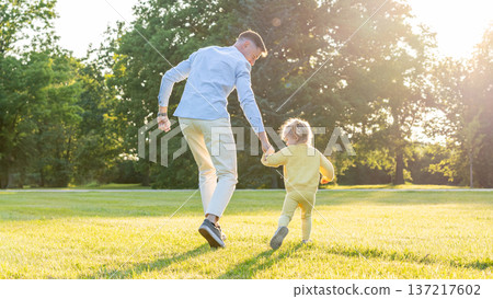 Dad daughter. Father child bonding moment in green park. Dad daughter. Father child bonding moment in green park. 137217602