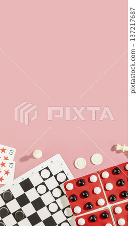 Board Games Flat Lay With Checkers, Dominoes And Playing Cards On Pink Background Board Games Flat Lay With Checkers, Dominoes And Playing Cards On Pink Background 137217687