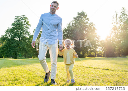 Dad daughter. Father child bonding moment in green park. 137217713