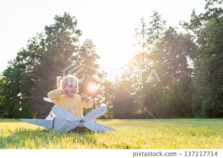 Pilot adventure. Girl flying airplane child. Cardboard costume imagination park. Pilot adventure. Girl flying airplane child. Cardboard costume imagination park. 137217714