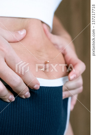 Female torso. Overweight abdomen detail. Real beauty concept Female torso. Overweight abdomen detail. Real beauty concept 137217718