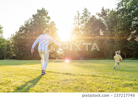 Dad daughter. Father child bonding moment in green park. 137217749