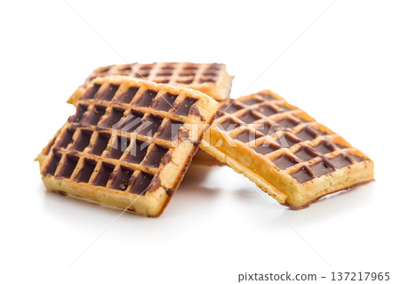 Sweet waffles with chocolate isolated on white background. Sweet waffles with chocolate isolated on white background. 137217965