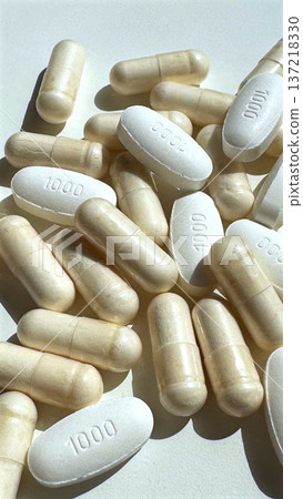 Scientific Observation Highlighting Embossed Medication Markings On Tablets. Clinical Study Emphasizing Detailed Features Of Beige And White Pill Tablets On Neutral Background Scientific Observation Highlighting Embossed Medication Markings On Tablets. Clinical Study Emphasizing Detailed Features Of Beige And White Pill Tablets On Neutral Background 137218330
