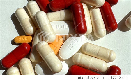 Mixed Red Beige And White Pills Arranged Closeup, Consumer Health Promotion Mood, Versatile Supplement Assortment For Marketing, Wellness Messaging And Product Catalog Applications 137218331