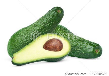 Green fresh avocados and half of avocado with pit isolated. Two avocado fruits and slice of avocado with seed with clipping path. 137218525