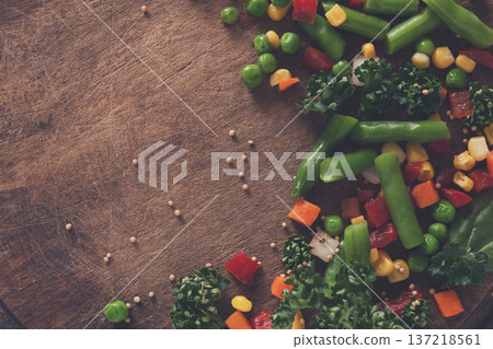 Healthy food, vegetarian nutrition. Organic vegetable mix on wooden table, close-up. Diet eating, copy space 137218561
