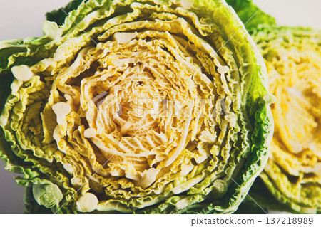 Closeup of fresh chinese cabbage cut in half. Natural organic vegetable background Closeup of fresh chinese cabbage cut in half. Natural organic vegetable background 137218989