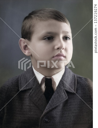 A vintage portrait of a stylishly dressed handsome boy in a suit and tie. Retro photo from 1966. A vintage portrait of a stylishly dressed handsome boy in a suit and tie. Retro photo from 1966. 137219274