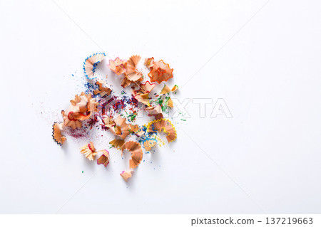 Wooden colored pencil sharpening shavings pile on white isolated background, top view, flat lay, copy space Wooden colored pencil sharpening shavings pile on white isolated background, top view, flat lay, copy space 137219663