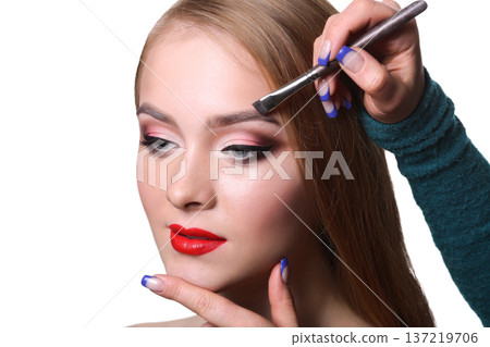Eyebrow shadow applying, brow modelling makeup closeup. Female model face with fashion make-up, beauty concept isolated 137219706