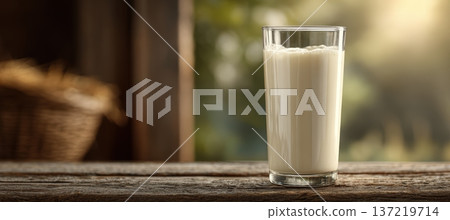 Fresh milk in transparent glass on rustic wooden surface, extreme close-up Fresh milk in transparent glass on rustic wooden surface, extreme close-up 137219714