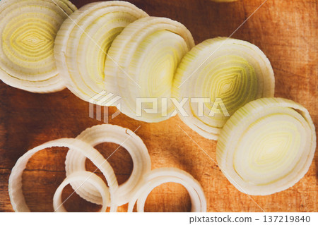 Cooking healthy food. Sliced and chopped leek closeup on wood background 137219840
