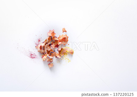 Wooden colored pencil sharpening shavings pile on white isolated background, top view, flat lay, copy space Wooden colored pencil sharpening shavings pile on white isolated background, top view, flat lay, copy space 137220125