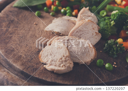 Healthy food, diet nutrition. Turkey and vegetable mix on wooden table, close-up. 137220207