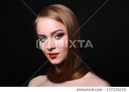 Beautiful woman model on black background with copy space, fashion shooting. Girl with makeup, perfect skin and hair posing to camera at studio Beautiful woman model on black background with copy space, fashion shooting. Girl with makeup, perfect skin and hair posing to camera at studio 137220210