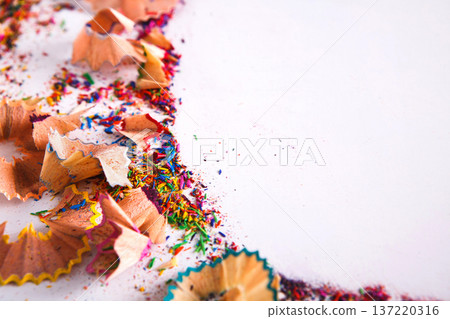 Wooden colored pencil sharpening shavings frame on white isolated background, top view, flat lay, copy space Wooden colored pencil sharpening shavings frame on white isolated background, top view, flat lay, copy space 137220316