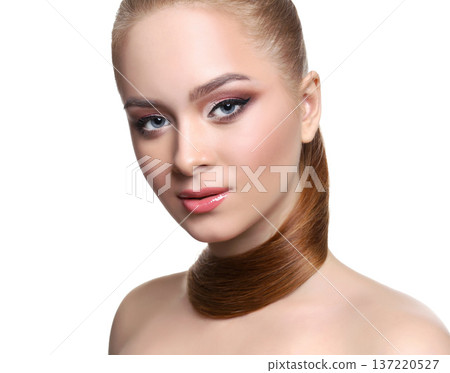 Beauty model isolated on white background, fashion shooting. Woman with makeup, perfect skin and hair posing to camera at studio Beauty model isolated on white background, fashion shooting. Woman with makeup, perfect skin and hair posing to camera at studio 137220527