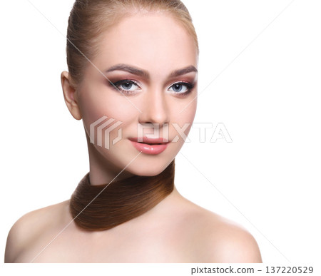 Beauty model isolated on white background, fashion shooting. Woman with makeup, perfect skin and hair posing to camera at studio Beauty model isolated on white background, fashion shooting. Woman with makeup, perfect skin and hair posing to camera at studio 137220529