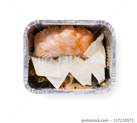 Healthy lunch in foil container. Healthy food take away and delivery. Vegetables, red fish and pita in box on white background, closeup, isolated Healthy lunch in foil container. Healthy food take away and delivery. Vegetables, red fish and pita in box on white background, closeup, isolated 137220571