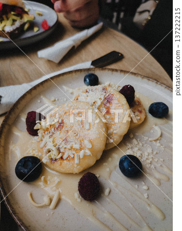 Traditional syrniki on ceramic plate 137222215