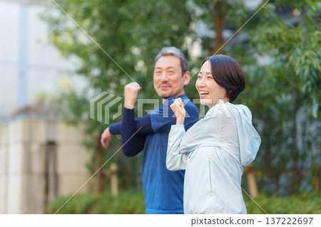 Men and women exercising 137222697